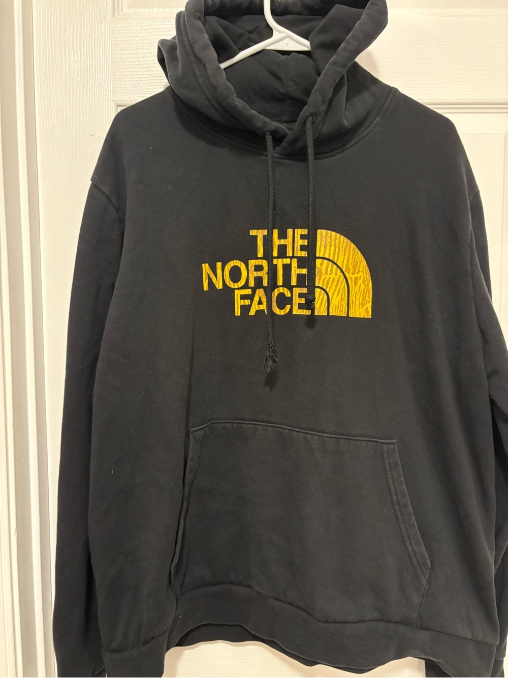 The North Face Black Pullover Hoodie with Yellow Logo